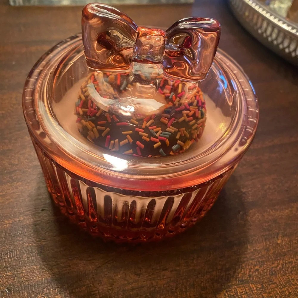 Adorable Donut Sprinkle Soy Candle in pink bow lidded glass jar. Donut scent